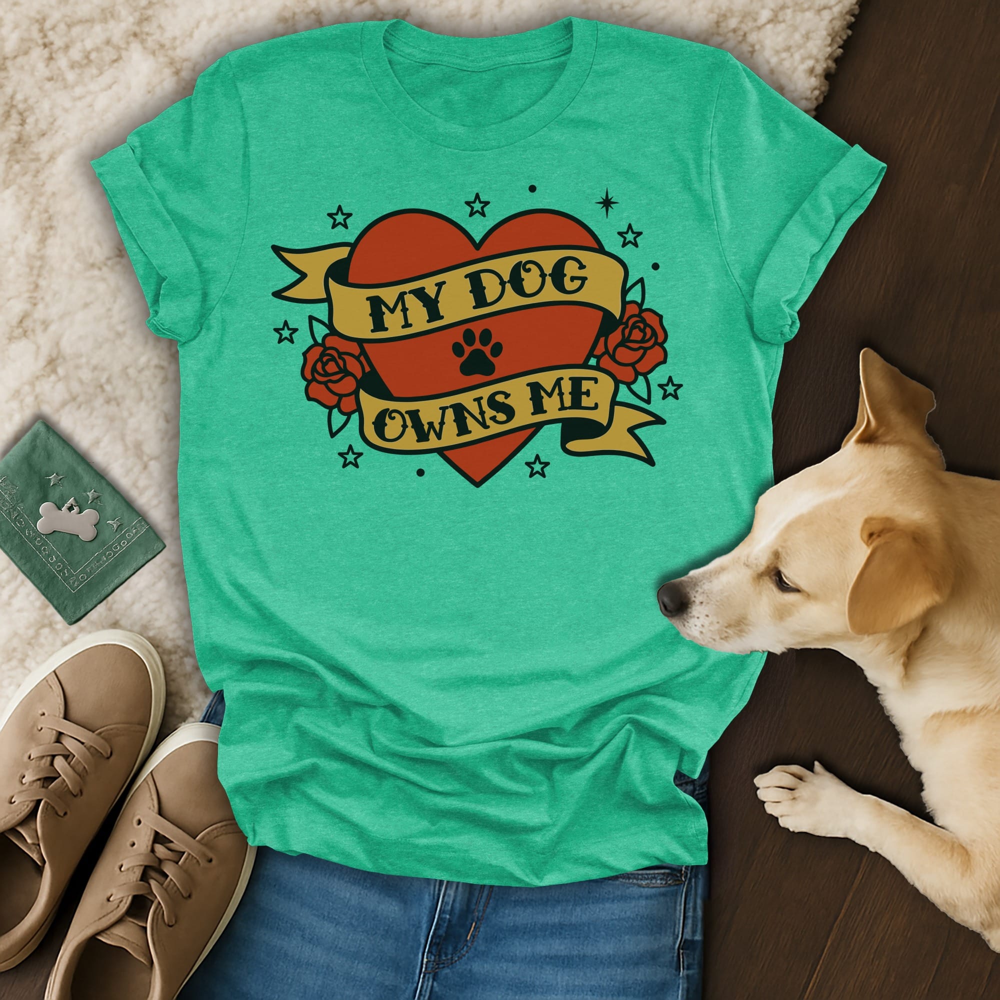 Teal t-shirt with "My Dog Owns Me" text inside a heart and rose design.