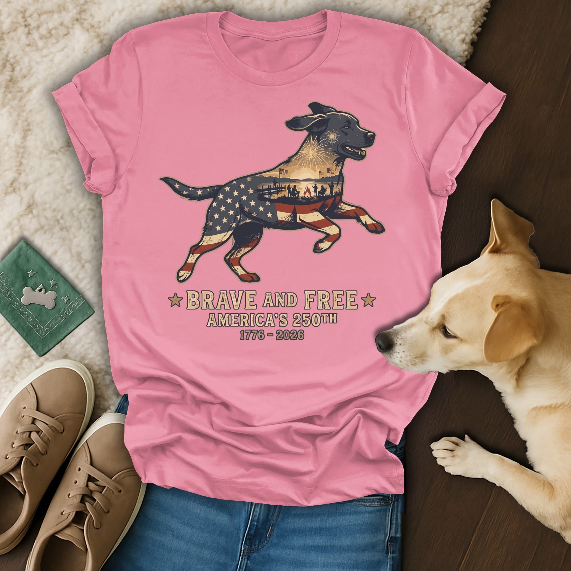 Pink t-shirt with patriotic dog graphic and "Brave and Free America's 250th" text.