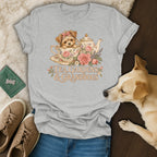 Heather gray t-shirt featuring a vintage illustration of a puppy in a teacup with the text Tea Gardens and Granddogs.