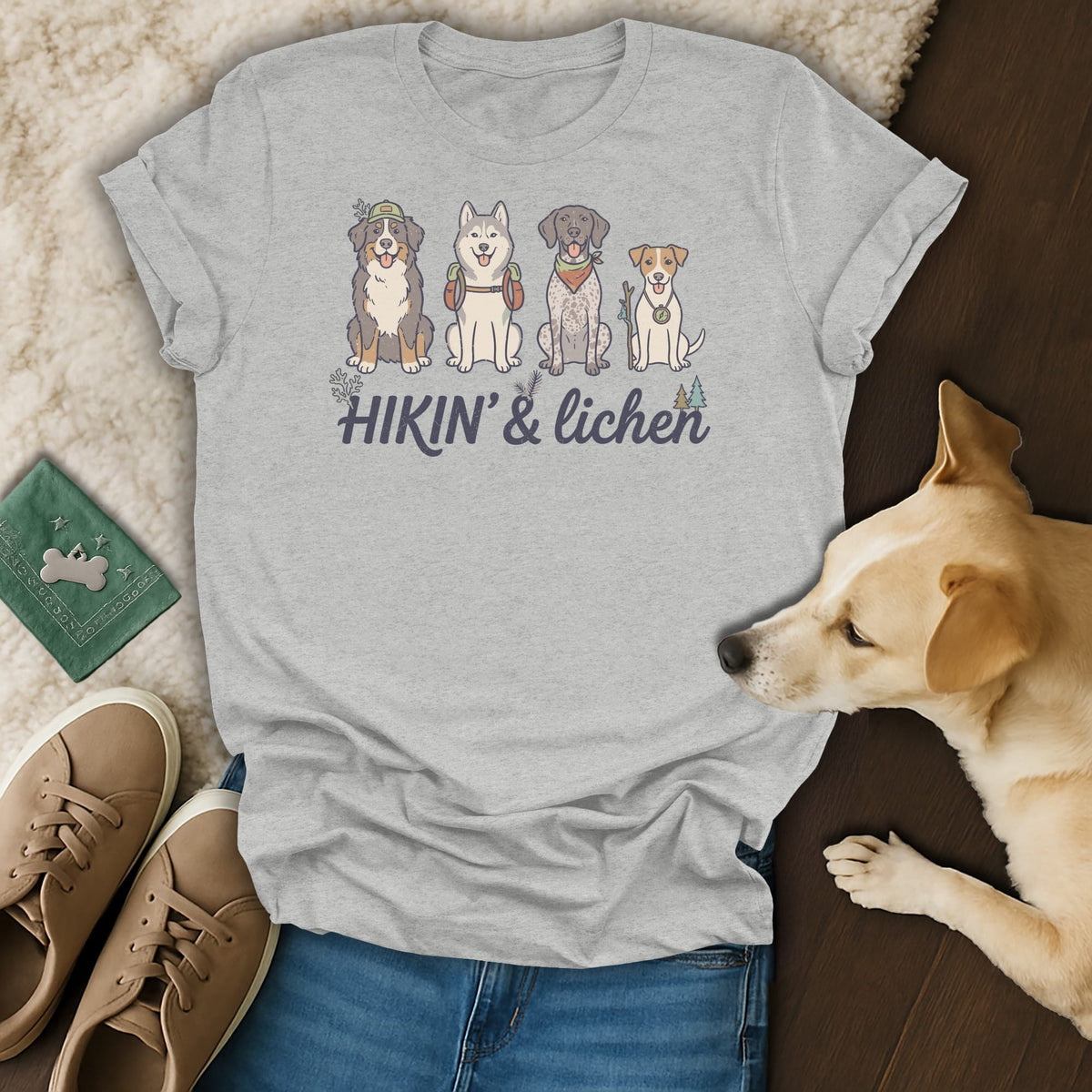 Light gray t-shirt with illustration of four dogs and the text "Hikin' & lichen."