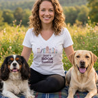 White t-shirt with "just a BOOK hound" graphic and dogs in a field.