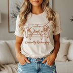 T-shirt with dog napping on couch graphic and "Currently Recharging" text.