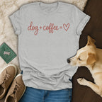 Grey t-shirt with red text "dog + coffee = ♡", dog, jeans, and shoes.