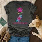 Dark gray t-shirt with hand holding flower and paw print, "picked this for you".