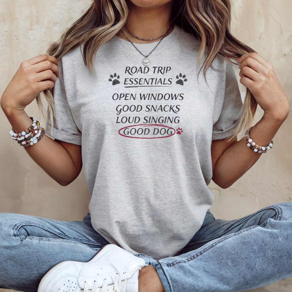 Grey t-shirt with "Road Trip Essentials" and "Good Dog" text.