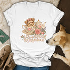 A white v-neck t-shirt displays a vintage illustration of a puppy in a teacup with flowers and text reading Tea Gardens and Granddogs.
