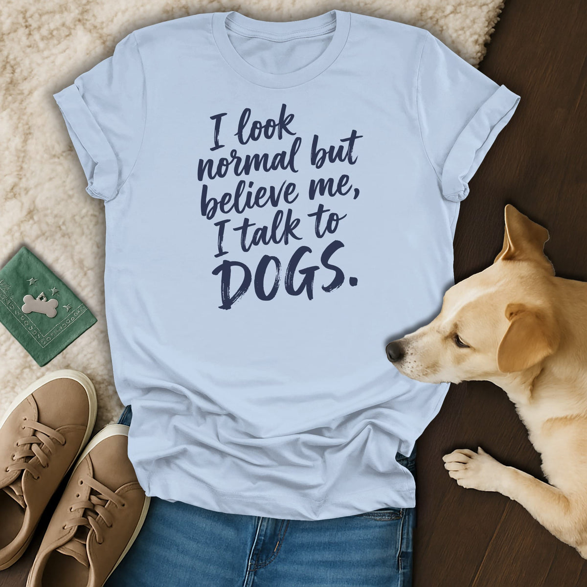 Light blue t-shirt with "I look normal but believe me, I talk to DOGS." text.