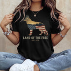Black t-shirt with a German Shepherd outline filled with American flag, "Land of the Free Est. 1776".