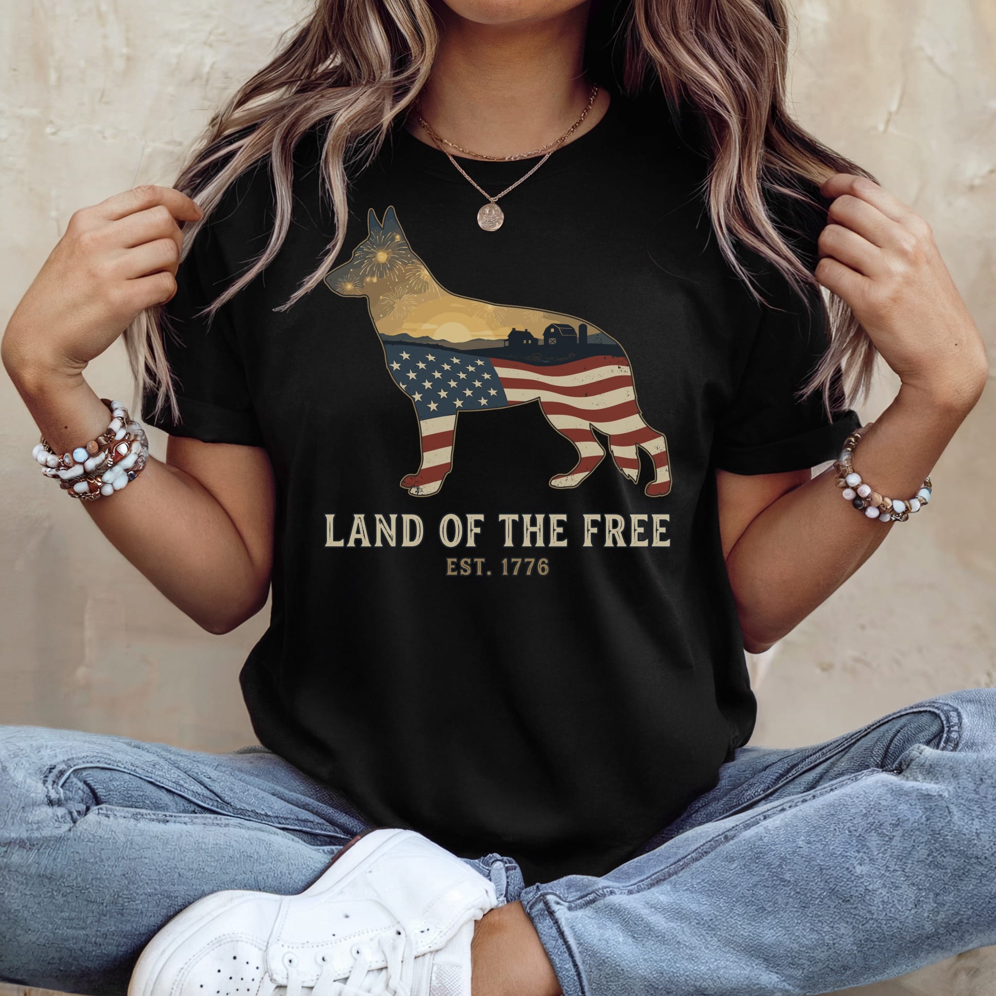 Black t-shirt with a German Shepherd outline filled with American flag, "Land of the Free Est. 1776".