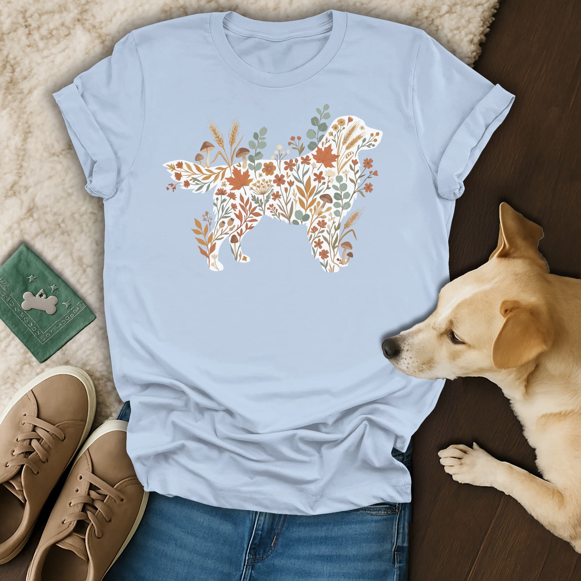 Light blue t-shirt with a dog silhouette filled with fall foliage and mushrooms.