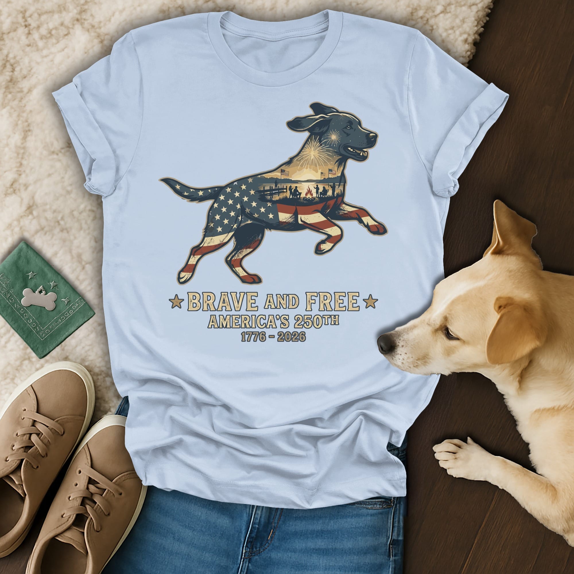 Light blue t-shirt with a dog silhouette filled with American flag and "Brave and Free America's 250th 1776-2026".