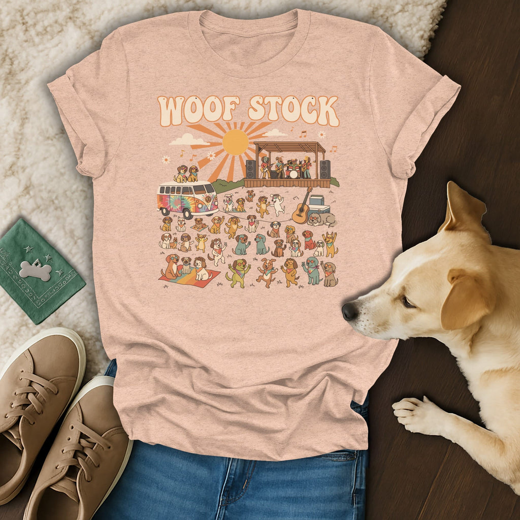 T-shirt graphic with "WOOF STOCK" text and dogs at a music festival.