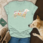 Light green t-shirt with white dachshund design filled with colorful wildflowers and a butterfly.