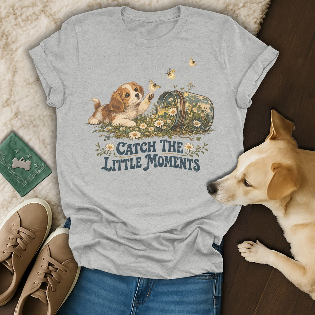 Heather gray t-shirt featuring a graphic of a puppy, flowers, and the text "Catch the little moments".