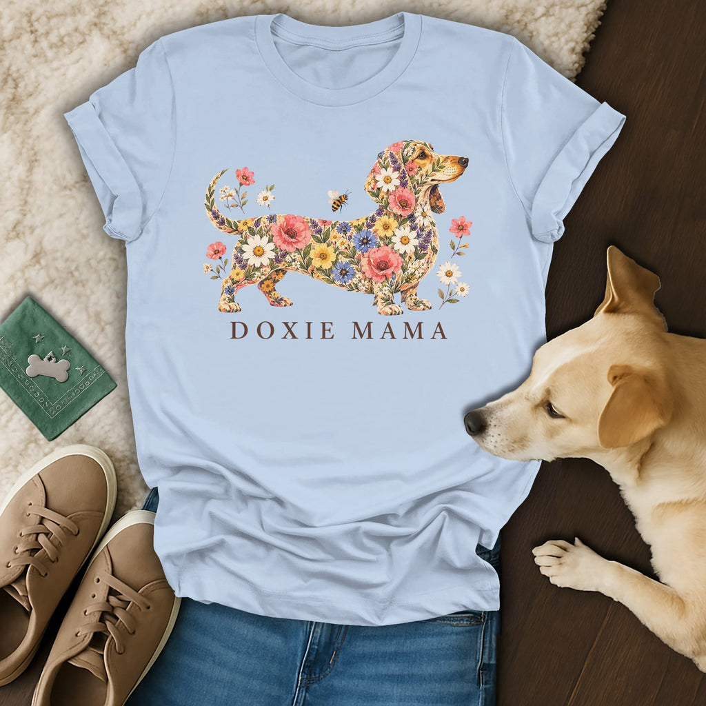 Light blue t-shirt featuring a dachshund filled with colorful flowers and the text DOXIE MAMA.