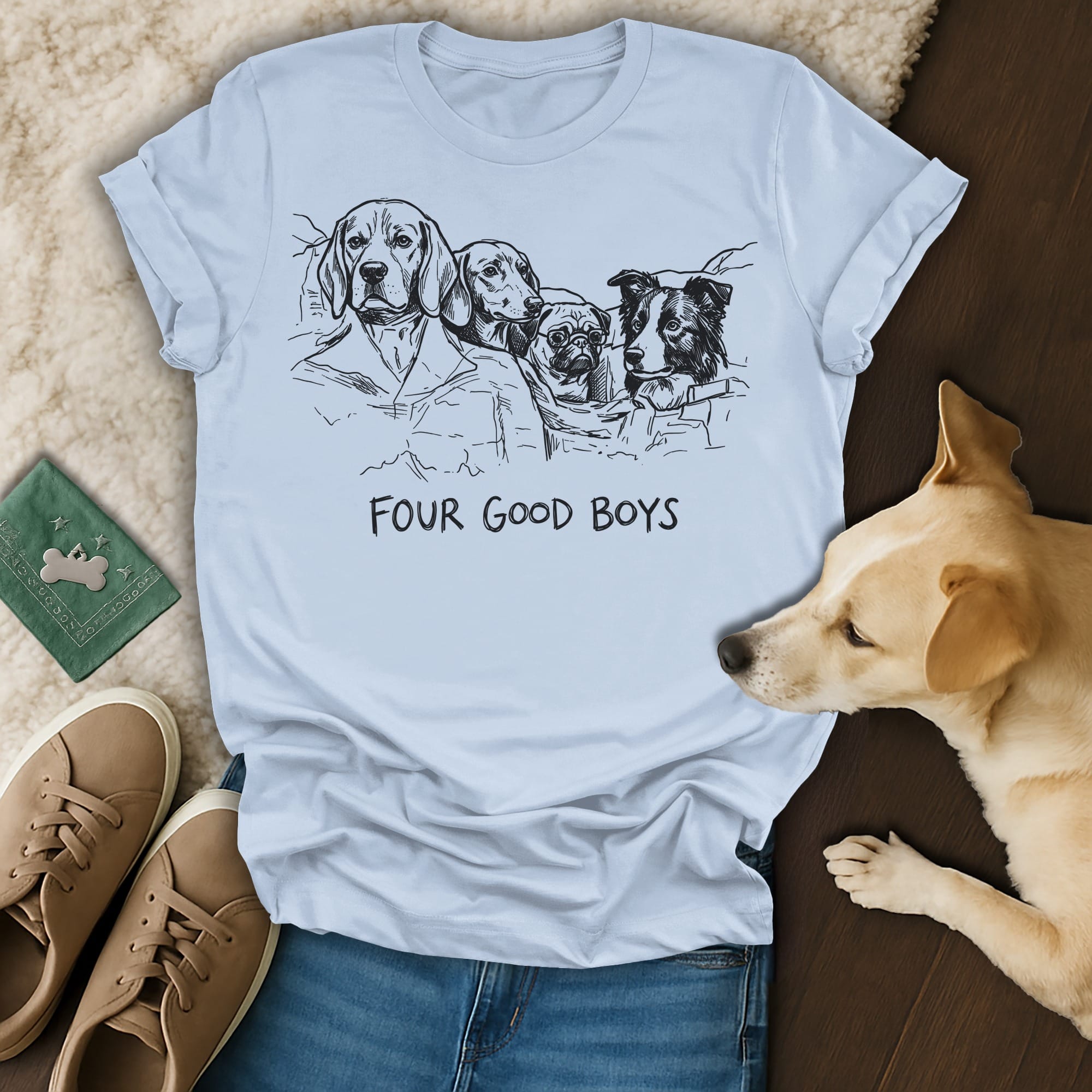 Light blue t-shirt with a sketch of four dogs and the text "FOUR GOOD BOYS."