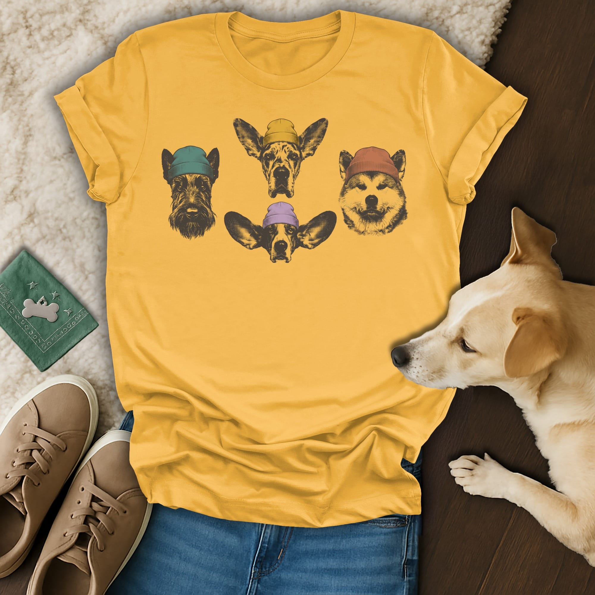 Yellow t-shirt with sketch art of four dogs wearing hats.