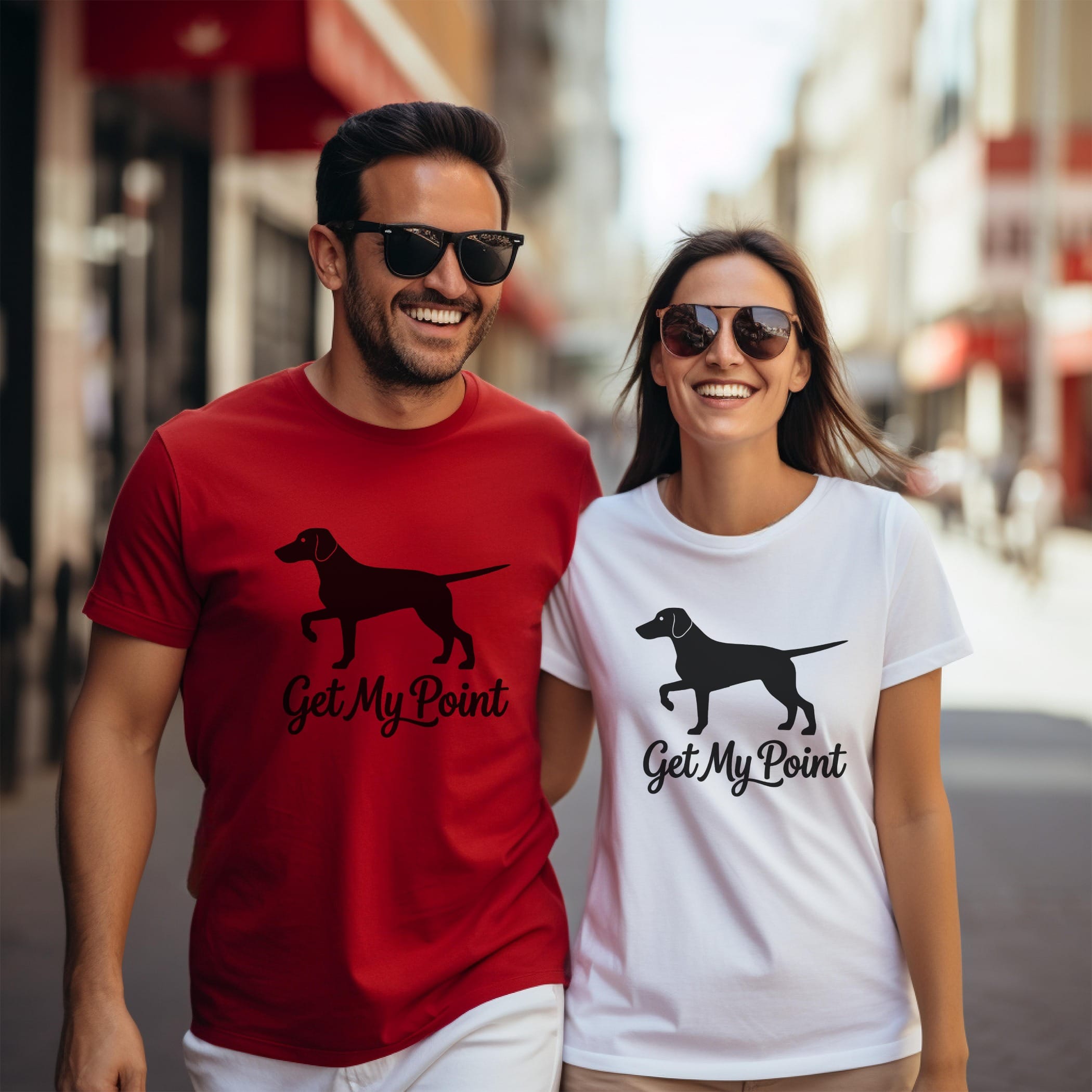 Couple wearing matching t-shirts with dog silhouette and "Get My Point" text.
