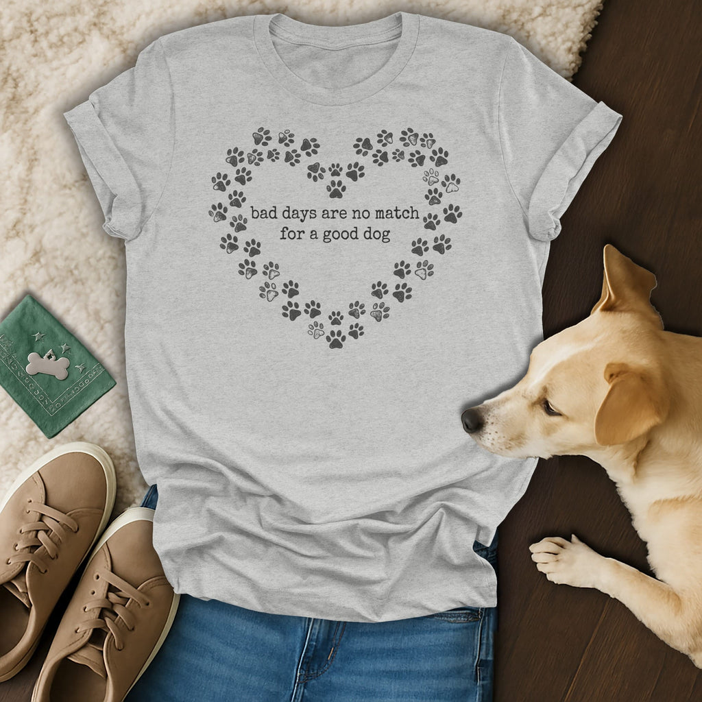 Grey t-shirt with a heart made of paw prints and text "bad days are no match for a good dog."