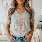Grey v-neck t-shirt with dog faces and flowers bouquet and text "PICK OF THE LITTER".