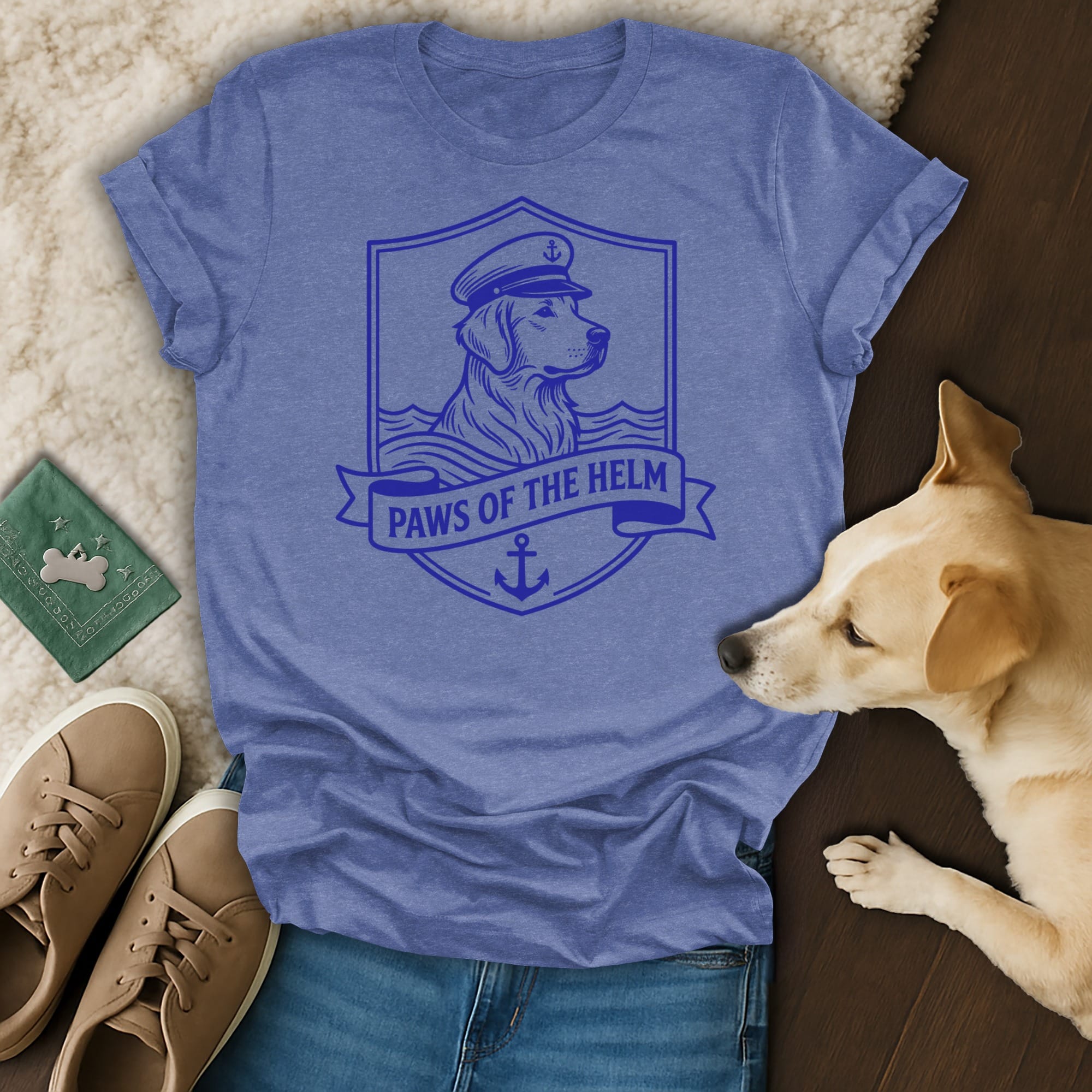 Blue t-shirt with a crest featuring a dog in a captain's hat, anchor, and "Paws of the Helm" text.