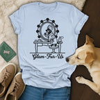 T-shirt graphic of a dog at a vanity with "Glam-Fur-Us" text.