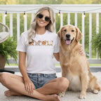 White t-shirt with a line of Halloween-themed dogs: witch, mummy, pumpkin, and ghost.