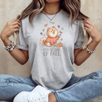 Grey t-shirt with illustration of dog in sweater and text "Fur-st Day of Fall".
