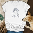 White v-neck t-shirt with a sketch of a dog in a paper bag.