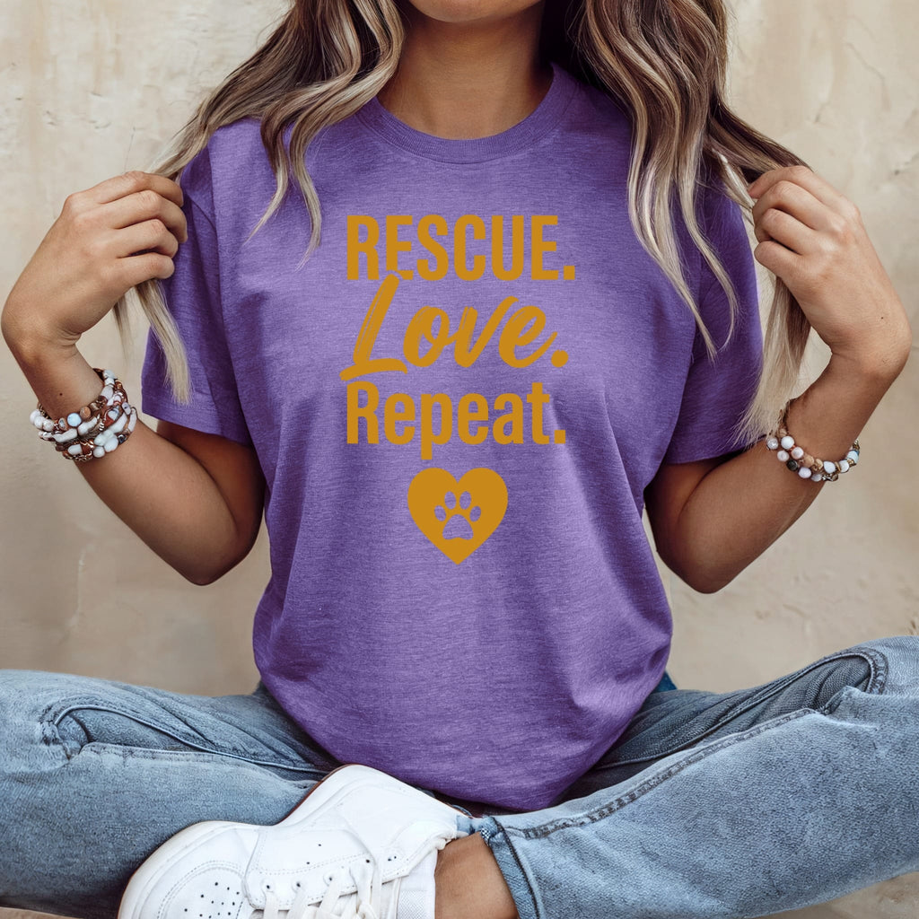 Purple t-shirt with "Rescue. Love. Repeat." and a heart paw print.