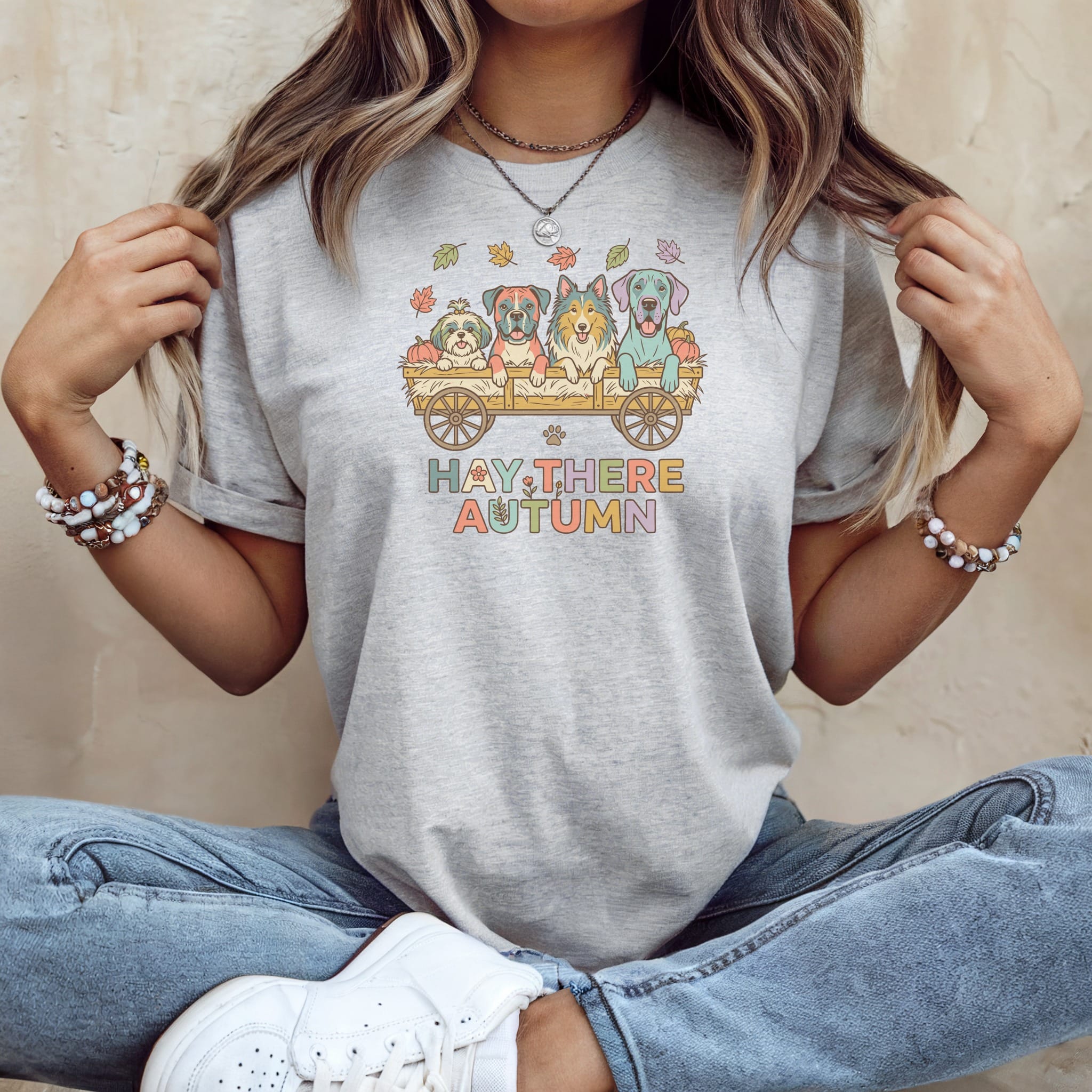 Graphic tee with four dogs in a wagon and the text "Hay there Autumn".