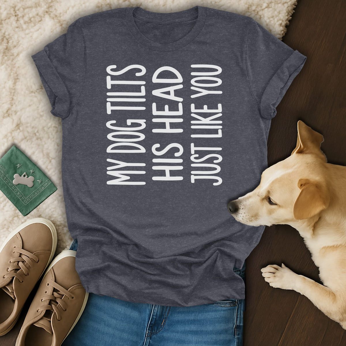 Dark grey t-shirt with white text "MY DOG TILTS HIS HEAD JUST LIKE YOU" and a dog.