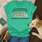 Green t-shirt with dogs and text "Terrified of the mailman".