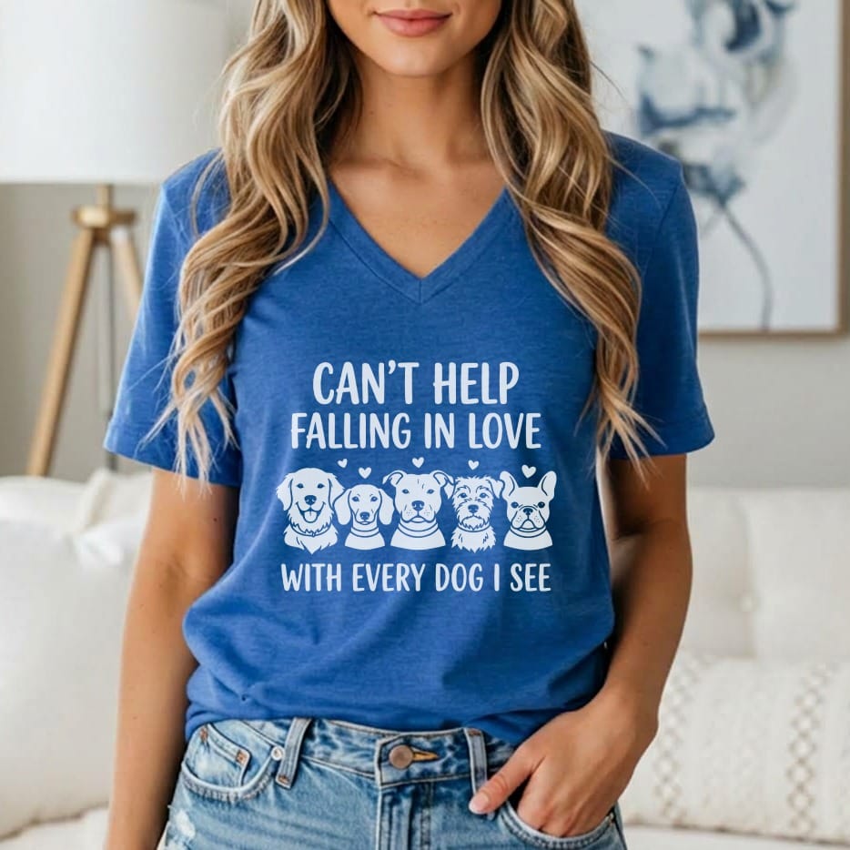 Blue v-neck t-shirt with white text and dog illustrations: "CAN'T HELP FALLING IN LOVE WITH EVERY DOG I SEE".