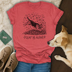 Red t-shirt with beagle jumping in leaves, text "LEAF ME ALONE."