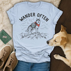 T-shirt with a husky wearing a bandana and backpack on a mountain, text reads "WANDER OFTEN".