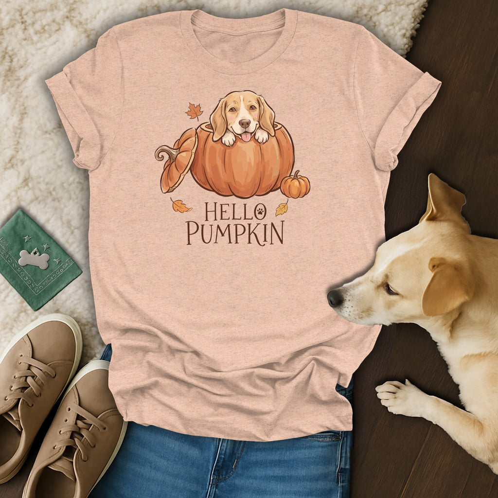 Peach t-shirt with illustration of a dog in a pumpkin, reading "Hello Pumpkin".