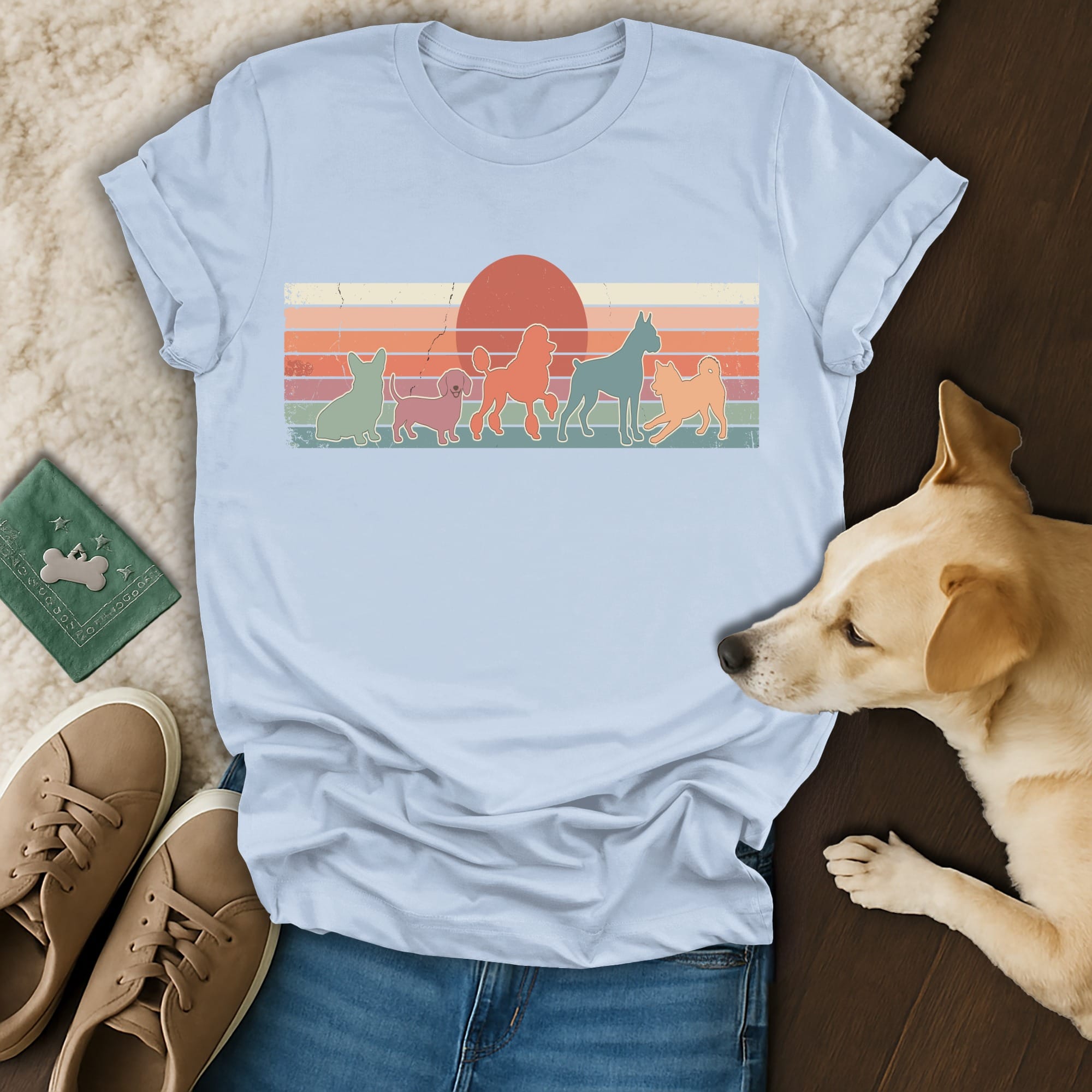 Lineup of dogs in retro style with sunset graphic on light blue t-shirt.