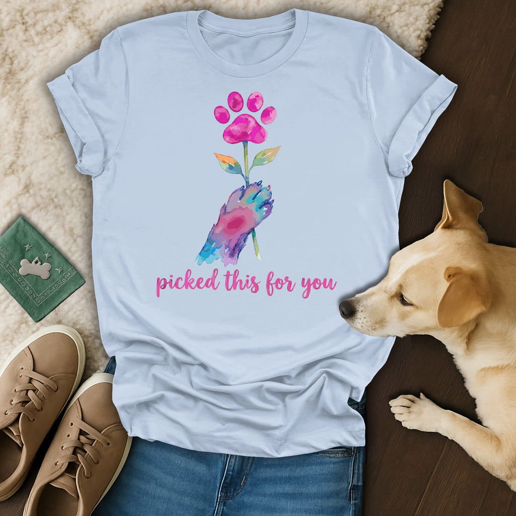 Hand holding watercolor paw print flower, "picked this for you" text.