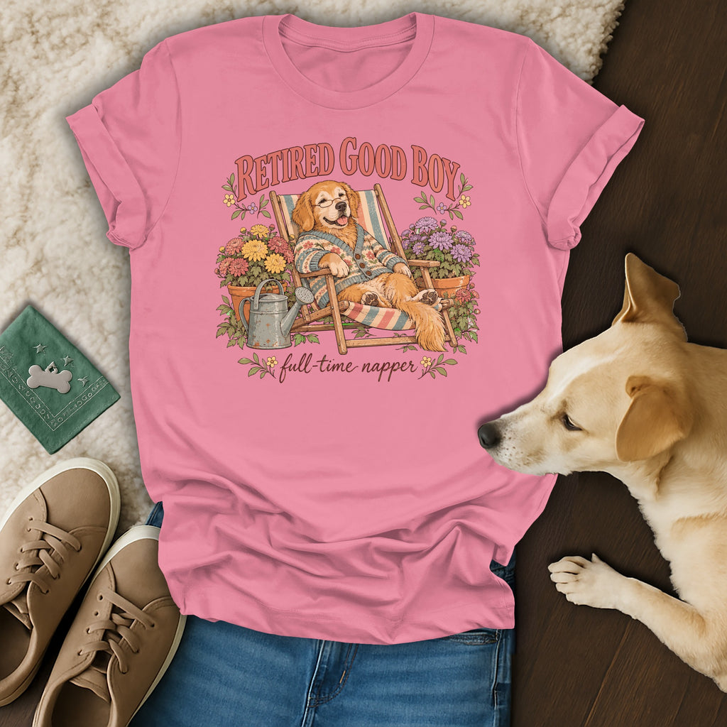 Pink t-shirt with a graphic of a golden retriever relaxing in a deck chair, surrounded by flowers.