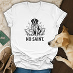 White v-neck t-shirt with black line drawing of a dog and "NO SAINT." text.