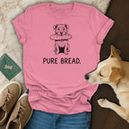 Pink t-shirt with a sketch of a dog holding a baguette and text "PURE BREAD."