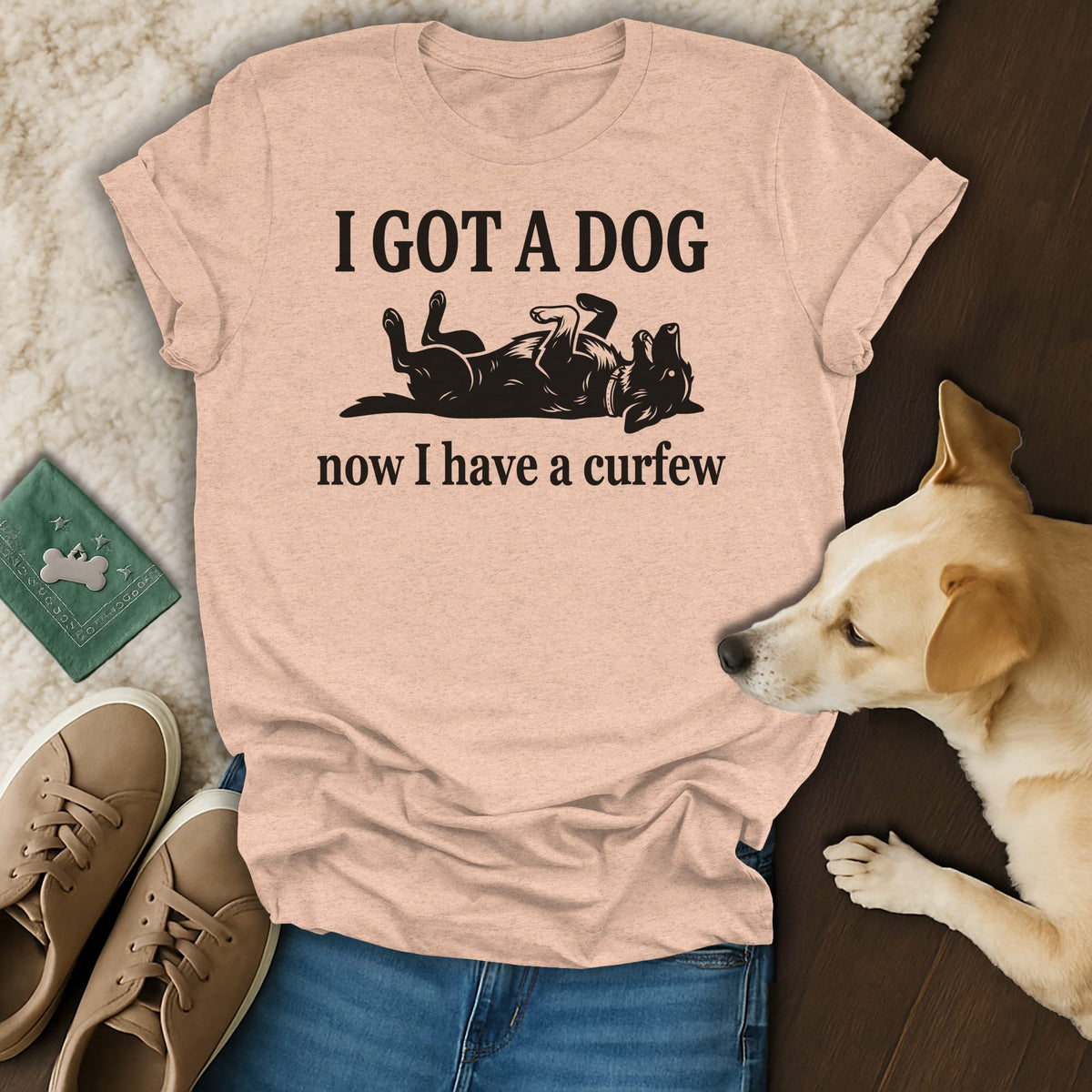 Light pink t-shirt with black text "I GOT A DOG now I have a curfew" and dog graphic.