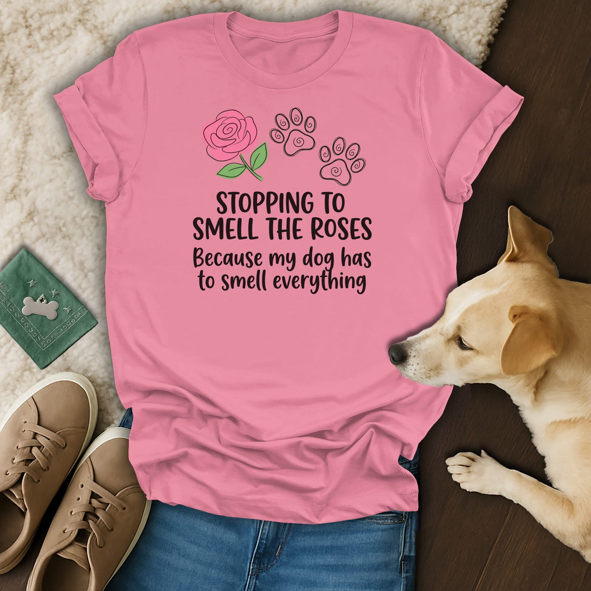 Pink t-shirt with text saying Stopping to smell the roses because my dog has to smell everything.