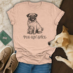 Peach t-shirt with a pug holding a coffee cup and the text "Pug-Kin Spice".