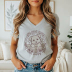 Grey t-shirt with a puppy in a floral circle that says "You have rules, I have puppy eyes."
