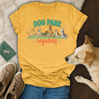 Yellow t-shirt with "DOG PARK regulars" text and cartoon dogs.