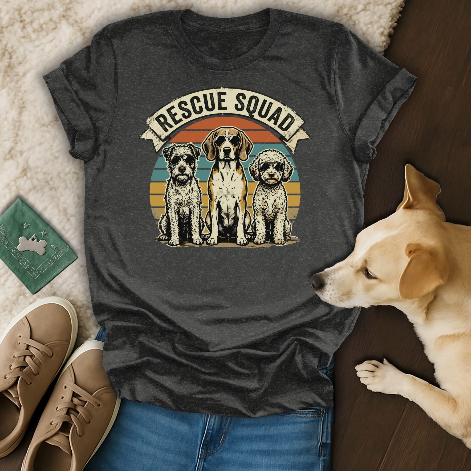 Graphic t-shirt featuring "Rescue Squad" text above three dogs.