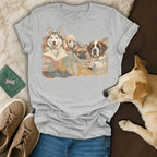 Grey t-shirt with watercolor painting of four dogs: husky, poodle, bulldog, and St. Bernard.