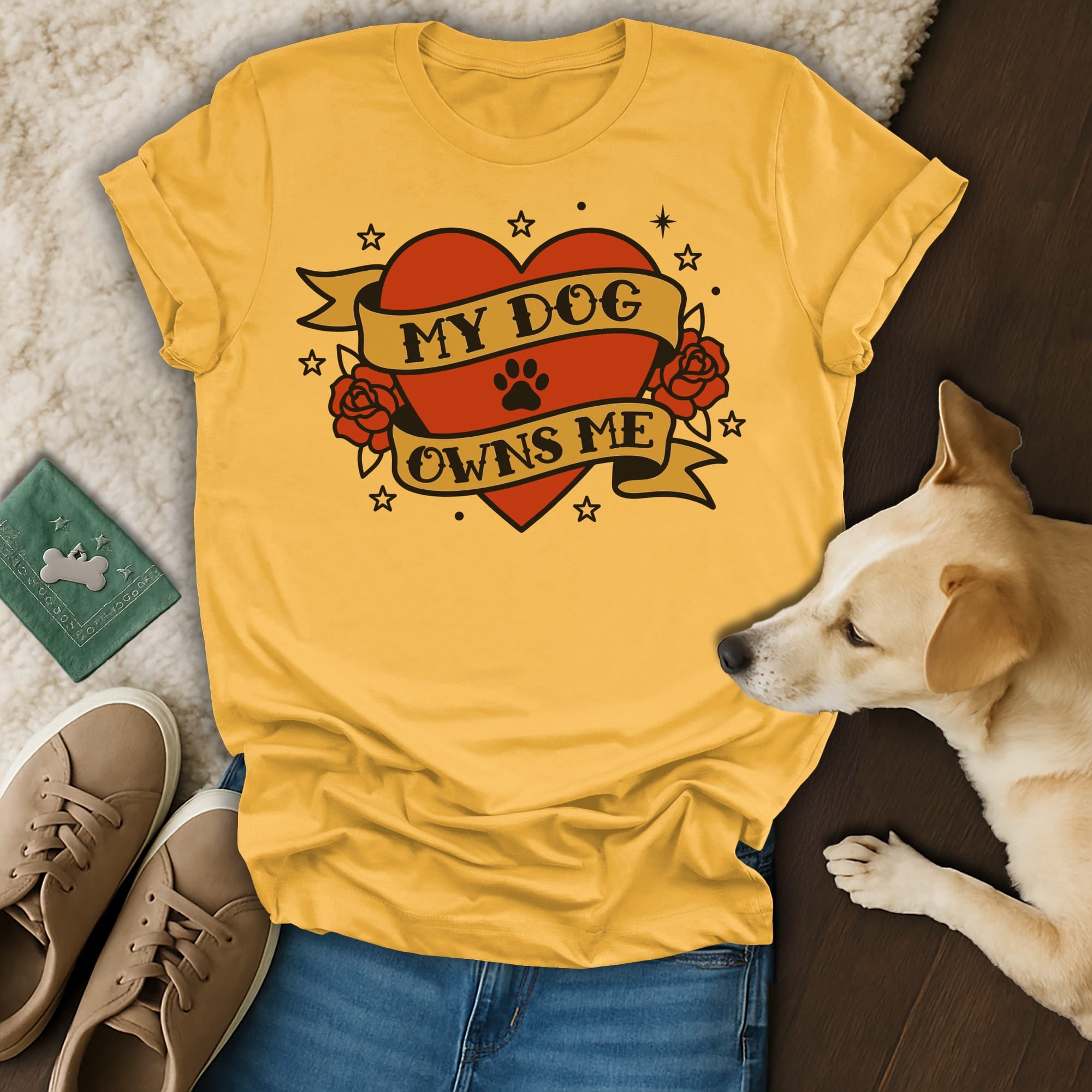 Yellow t-shirt with "My Dog Owns Me" heart tattoo design.